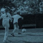 Kids playing football